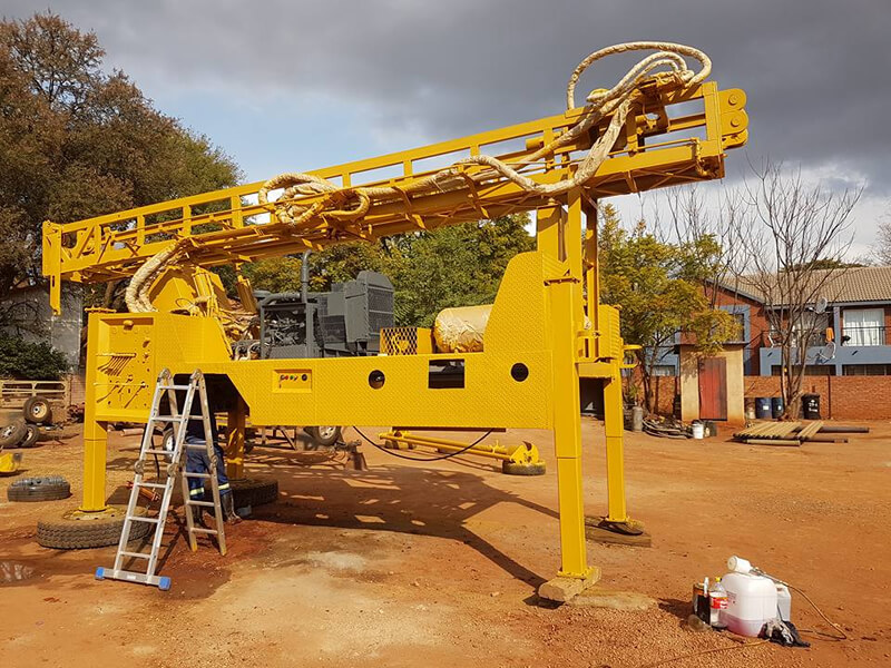 yellow painted drilling truck part