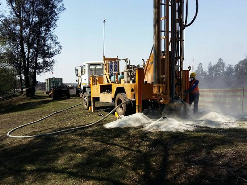 drilling truck grassland with white sand
