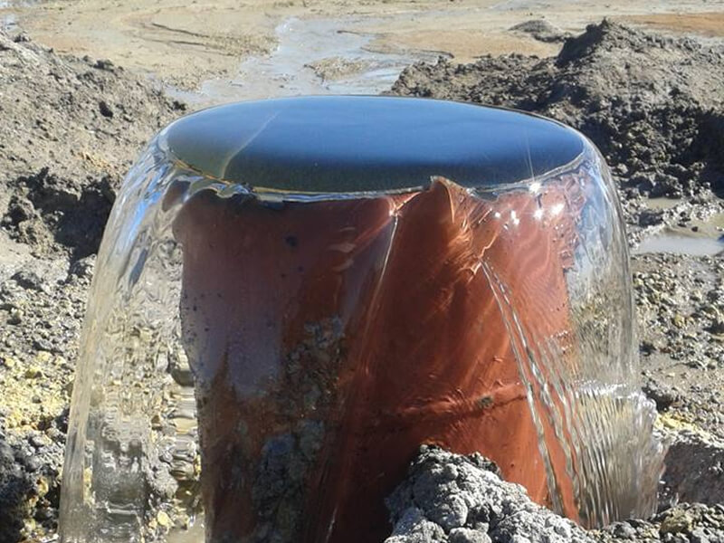 barrel overflowing with water
