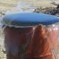 barrel overflowing with water