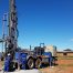 workers operating a drill truck